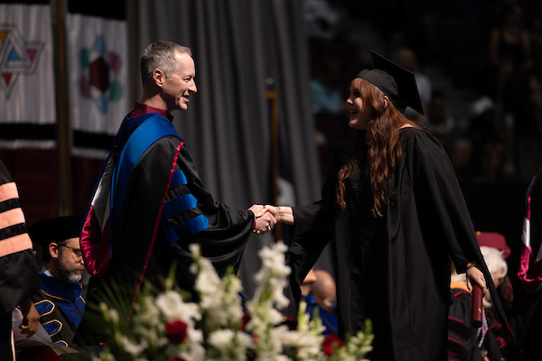 Student at Commencement Shaking Hands with Department Head