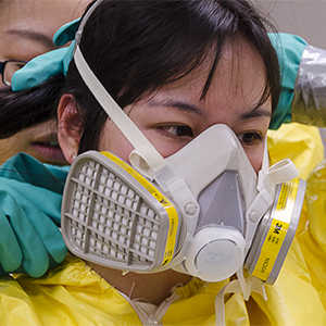 Student putting on respirator