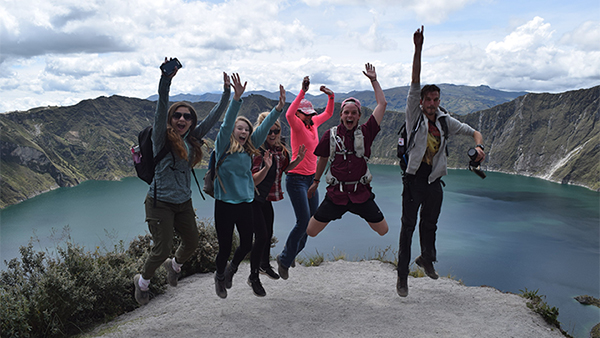 Students on Practicum Jumping on Rock